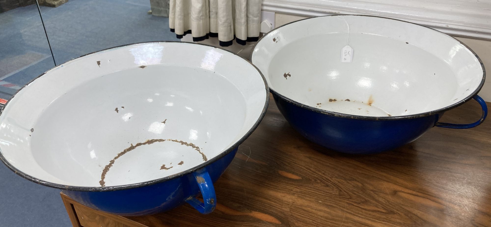 A pair of French enamel two-handled pans, 57cm diameter, 22cm high